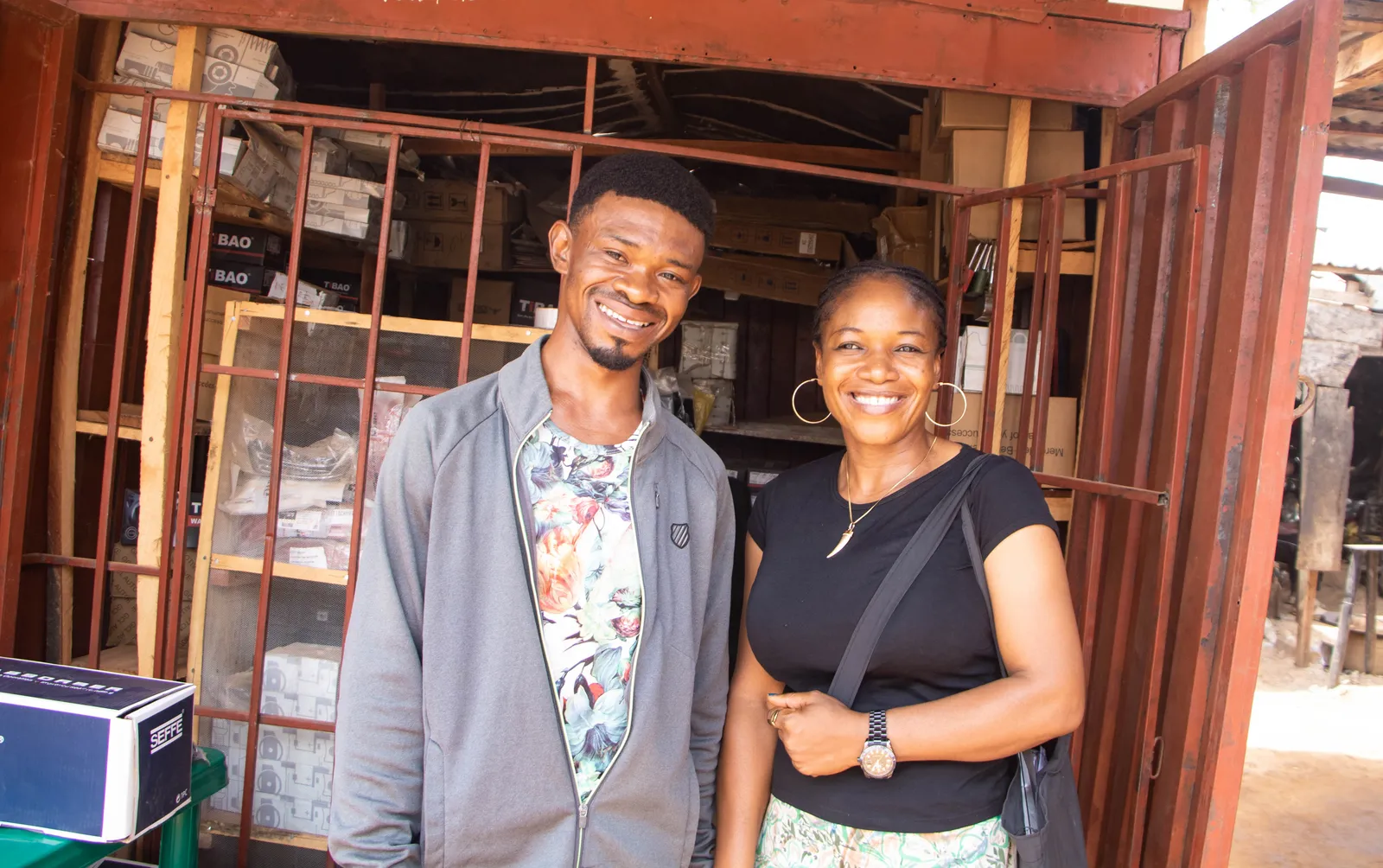 DR-TB Survivor, Simon Chukwuma with a community-based organization program support staff, Gladys Shir at his shop in Apo Mechanic Village, Abuja