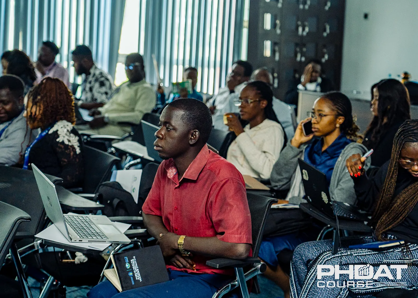 Participants at the training receiving hands on practical mentoring on public health data analysis